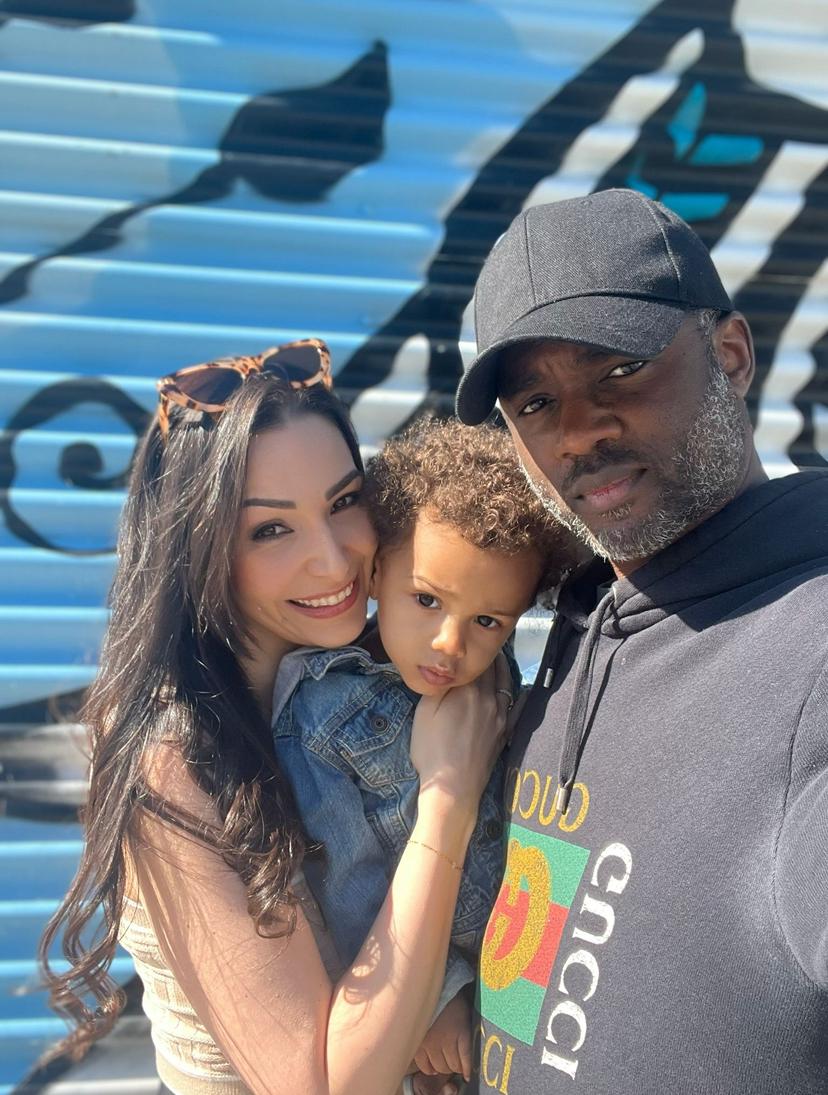 The family before a painted wall